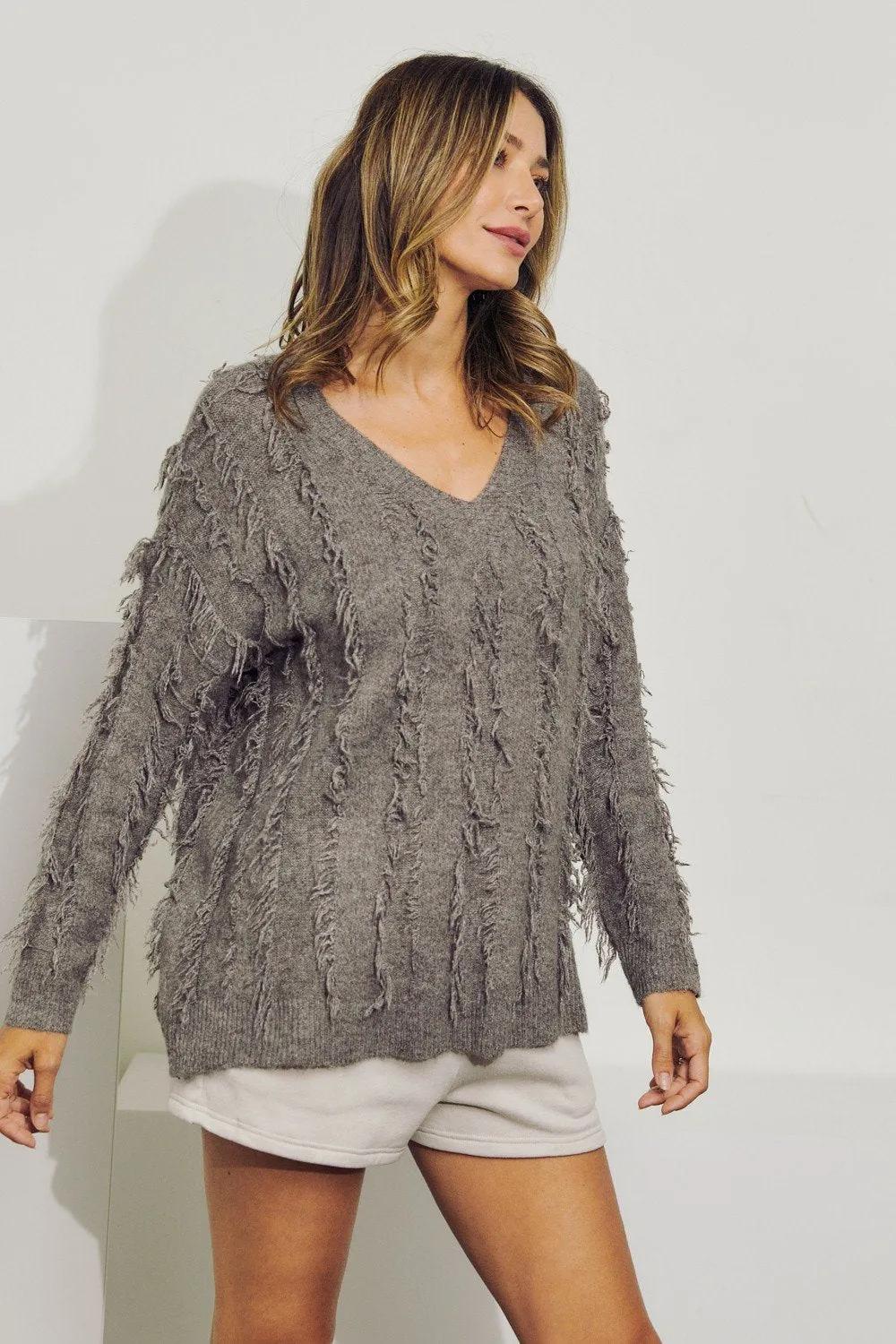 V-Neck long sleeve wool sweater top with fringe